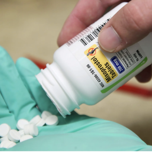 A pharmacist poses with pills of Misoprostol